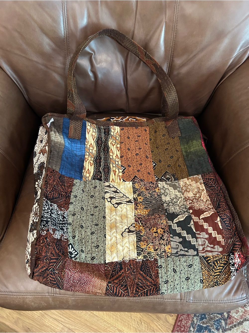 Beautiful Indonesian true patchwork tote bag with top zipper. Measures 20”x20”.